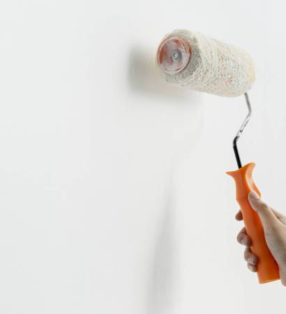 Hand painting the wall white